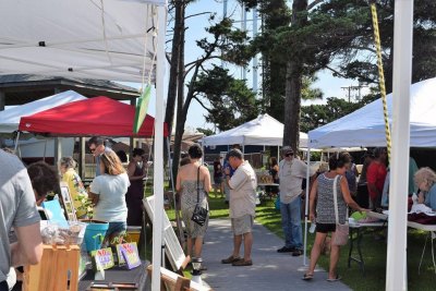 Fig Festival vendors set up along the walkway and in the Museum's back yard.